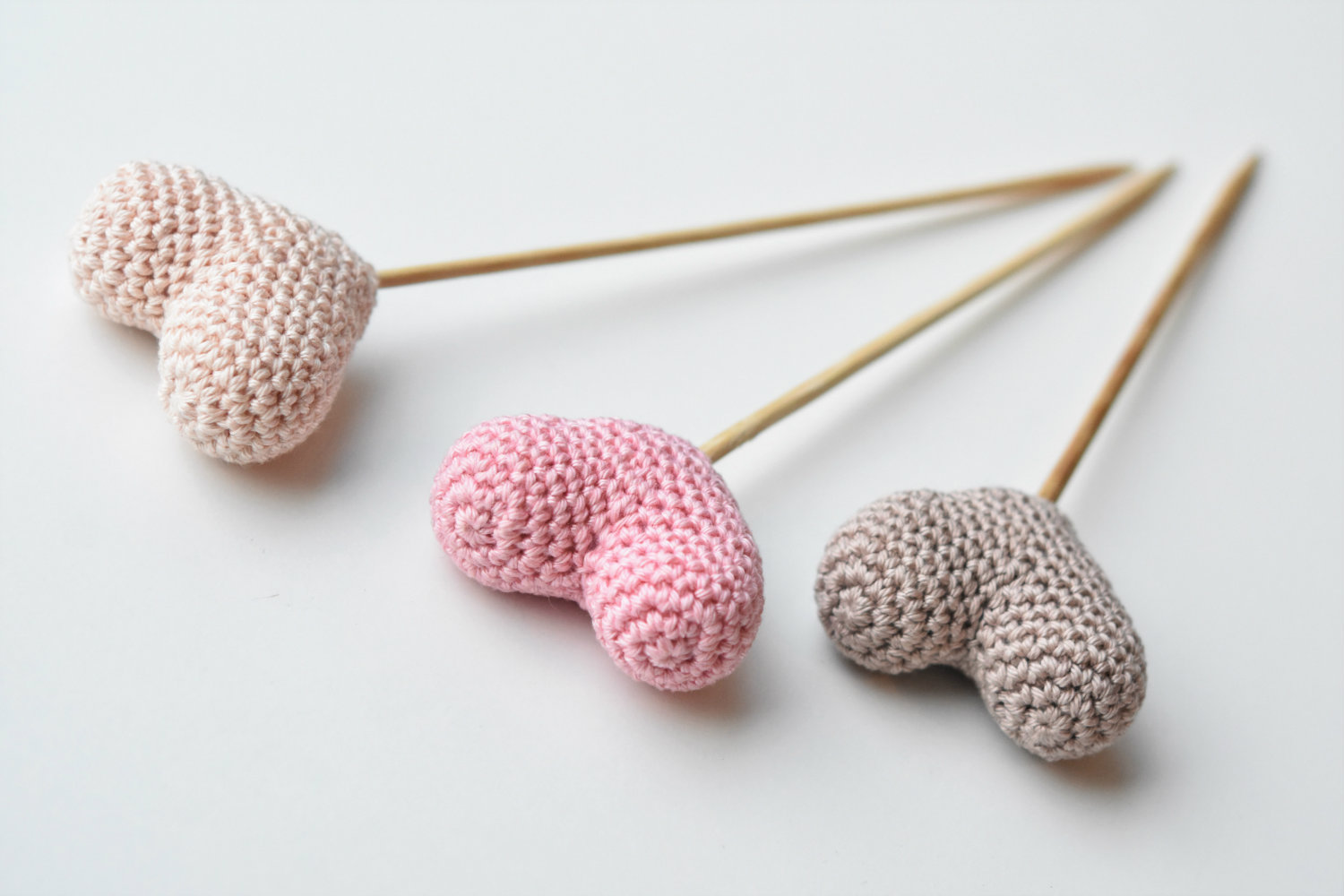 amigurumi hearts on a stick