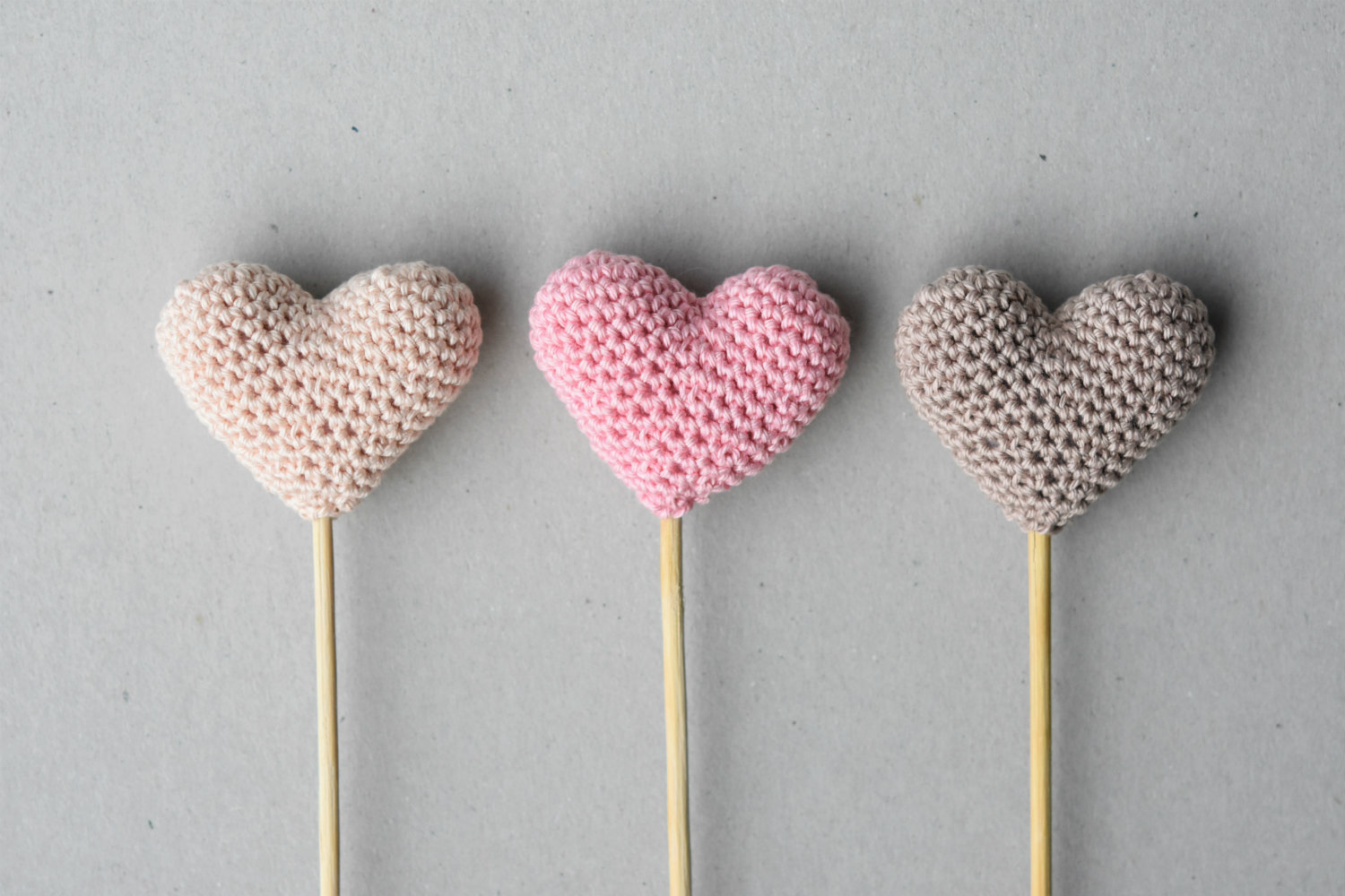 amigurumi hearts on a stick