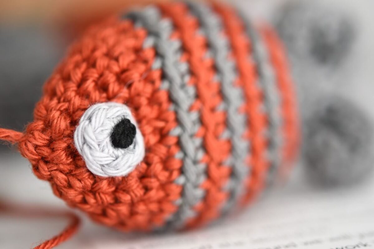 lilleliis - Amigurumi fish keychain in duty Want to do this yourself? Find  crochet pattern in my book Cuddly Amigurumi Toys:  amigurumi-crochet-books/cuddly-amigurumi-toys/