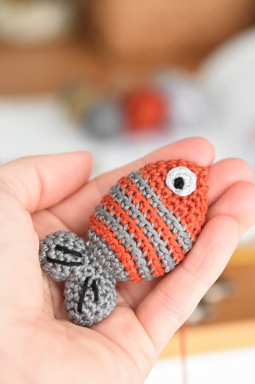 lilleliis - Amigurumi fish keychain in duty Want to do this yourself? Find  crochet pattern in my book Cuddly Amigurumi Toys:  amigurumi-crochet-books/cuddly-amigurumi-toys/