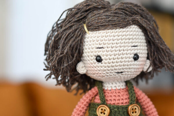 Crochet doll in wool skirt