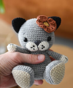 gray crochet kitten with poppy flower