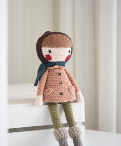 Crochet doll in a coat and bonnet