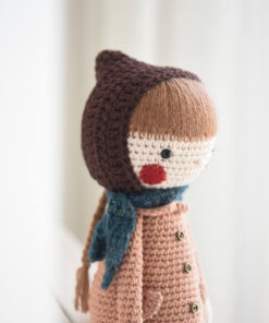 Crochet doll in a coat and bonnet