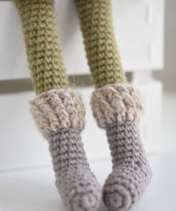 Crochet doll in a coat and bonnet