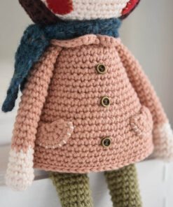 Crochet doll in a coat and bonnet