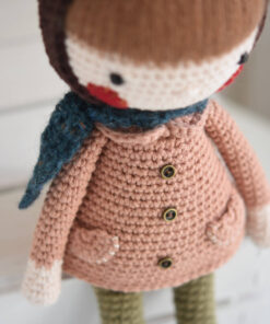 Crochet doll in a coat and bonnet