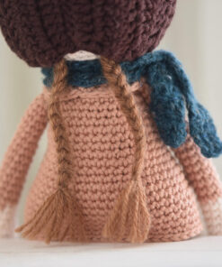 Crochet doll in a coat and bonnet