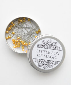 Long sewing pins in tin